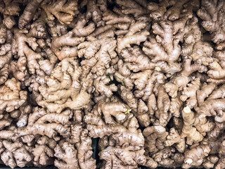 Ginger root in a box, medicinal plant for food ingredient whole ,lying in drawer in supermarket .concept proper nutrition vitamins for cold