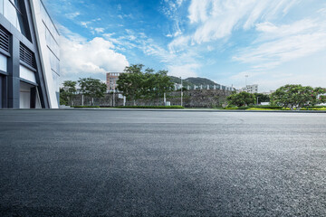 Empty asphalt and city buildings landscape in summer