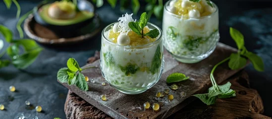 Fotobehang Mixed Bandung Ice, Oyen Ice. A cold Asian dessert with tapioca pearls, jackfruit, avocado, coconut, and condensed milk. © AkuAku