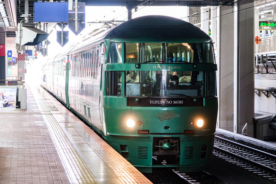 FUKUOKA, JAPAN - DEC 17, 2023: Yufuin No Mori sightseeing train of JR Kyushu bound for Yufuin, a hot spring sort, is stopping at platform of Hakata Station