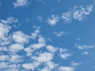 abstract outdoor sunny day blue sky high small group clouds background in summer gradient light white background. beautiful bright cloud and calm fresh wind air.