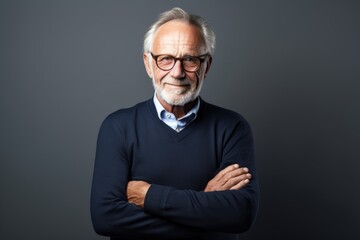 Fototapeta premium An older man wearing glasses and a sweater
