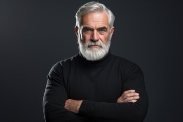 A man with a white beard and a black shirt