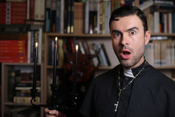Priest holding a candelabra with spooky demon in the background