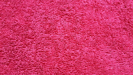 Fabric texture. Natural colored cotton fabric. Cotton. Burgundy terry fabric. Interweaving of fibers. Cotton towels.