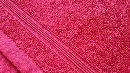 Fabric texture. Natural colored cotton fabric. Cotton. Burgundy terry fabric. Interweaving of...