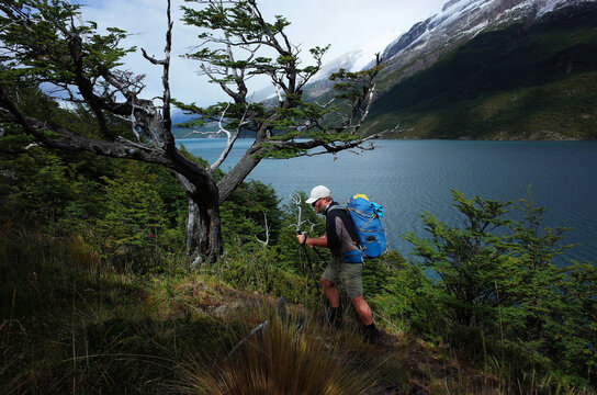 Hiking in Patagonia, Man trekking along the Del Desierto Lake in Argentina