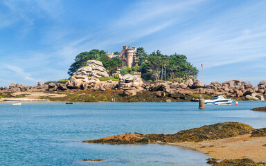 View of the island of Costaérès with its famous castle (built in 1885), rocky coastline, on the...