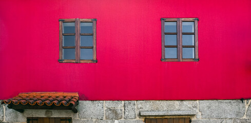 House with style and fuchsia facade in Combarro, province of Pontevedra, Galicia, Spain