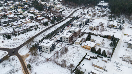 Drone photography of modern houses in a city suburb during winter day