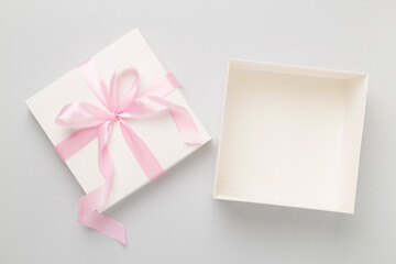 White open gift box on color background, top view. Mock up for design