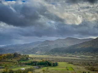 Foto op Canvas The landscape of Carpathian Mountains in the cloudy weather. Perfect weather condition in the spring season © thaarey1986