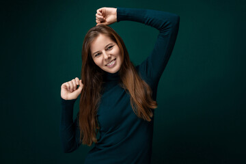 Caucasian young woman with brown eyes actively shows her bright emotions