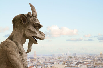 Gargoyle close up on Notre Dame Cathedral church in Paris, France