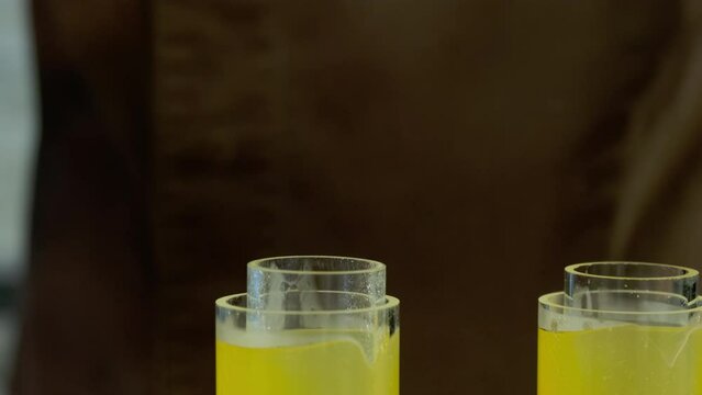 Molds filled with mixture of juice and spices to create stuffing. Gelatin component causes liquid to solidify into cylindrical shape
