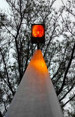 Looking up at a brightly glowing streetlamp.