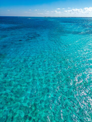 Beautiful aerial view of the Cayman Islands in the Caribbean with pristine beach turquoise blue green water sea ocean
