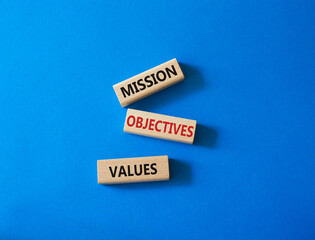 Mission Objectives Values symbol. Concept words Mission Objectives Values on wooden blocks. Beautiful blue background. Business and Mission Objectives Values concept. Copy space