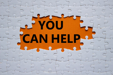 You can help symbol. Concept words You can help on white puzzle. Beautiful orange background....