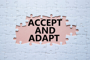 Accept or adapt symbol. Concept words Accept and adapt on white puzzle. Beautiful pink background....