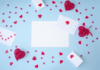 Blue background, Valentine's Day flat lay, copy space for text, holiday gifts frame, envelope and...
