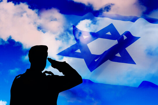 Israel. Silhouette of an Israeli soldier in front of the Israeli Flag. Concept photo: Israel national holiday - Israel Independence Day
