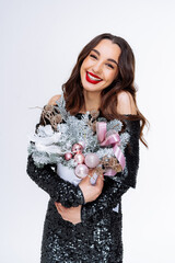 A Woman in a Black Dress Holding a Bouquet of Flowers