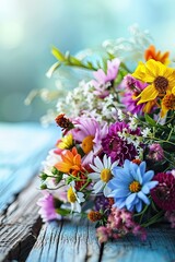 Colorful bouquet of flowers on wooden table