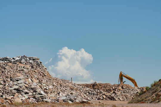 A construction area with rubble and a pale blue sky in Phoenix, Arizona