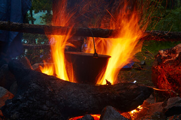 Evening dinner on a campfire.