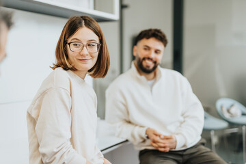 Young colleagues collaborate in the office, sharing ideas for business growth and market expansion during work session.