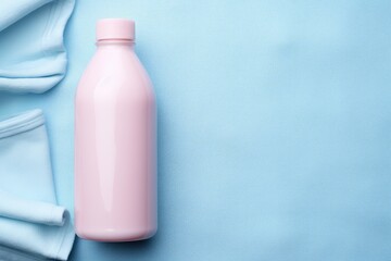 Mockup bottle of fabric softener or detergent over textile astel background