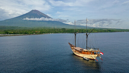 Traditional wooden boat and mountain background