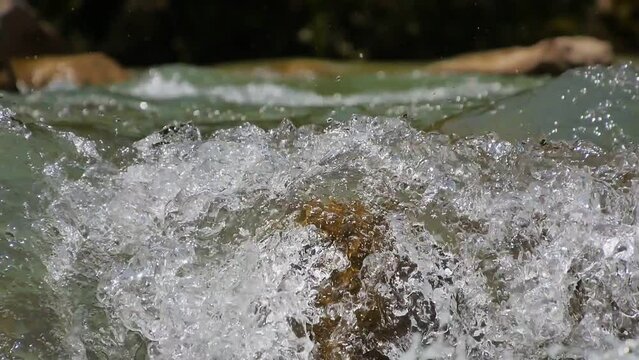 water waves on rocks in the river