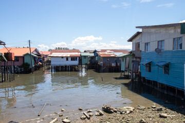 Stilt houses along a waterfront in a coastal village