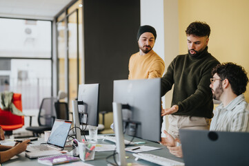 Multicultural coworkers collaborating on a new project in a corporate office, strategizing and analyzing data for business growth.