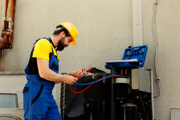 Capable serviceman hired to check external air conditioner freon tank in need of troubleshooting,...