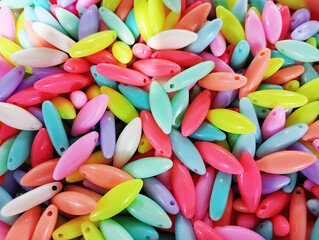Colorful oval shape plastic beads for sale in the accessories shop. Kid's DIY craft. Children's...