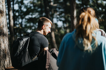 Group of friends hiking in the mountains, enjoying a sunny day in the forest. They have fun conversations while exploring the natural environment and engaging in healthy physical activity.