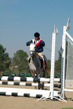Teenage girl showjumping at an equestrian event, Johannesburg, South Africa