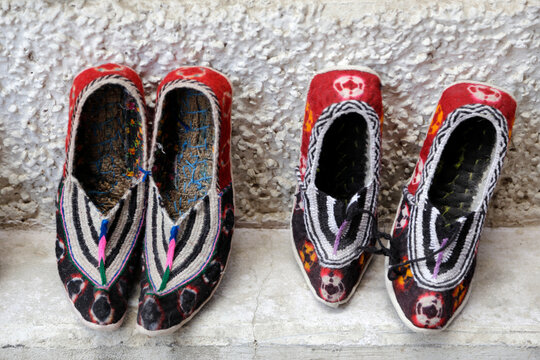 Close-up of two pairs of Traditional Ladakhi shoes for sale in a bazaar, Leh, Ladak, Jammu and Kashmir, India