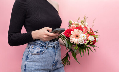 Young Caucasian Woman In Denim Holds Phone With Bouquet Of Fresh Flowers Roses, Gerbera,...