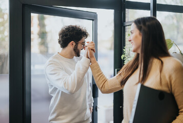 Colleague arrives, met by the businesswoman's friendly welcome, initiating a productive day.