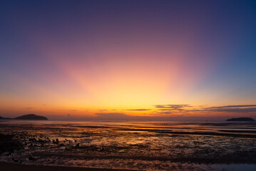 Beautiful sky in the morning at Saphanhin public beach, Phuket, Thailand.