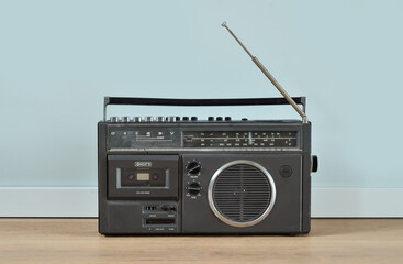 Retro radio receiver near light wall