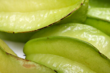 three carambolas. green fruits. fruits with selective focus. star fruits known as carambola.