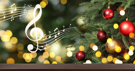 Music notes and table near Christmas tree on blurred background, bokeh effect. Banner design with...