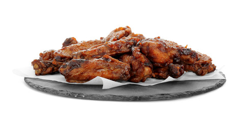 Slate board with delicious chicken wings isolated on white