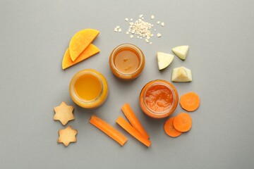 Flat lay composition with healthy baby food on grey background