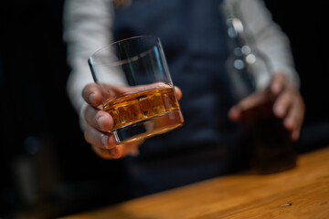 Barman pouring whiskey whiskey glass.. - obrazy, fototapety, plakaty